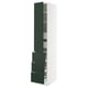 White tall kitchen cabinet with green doors and drawers.