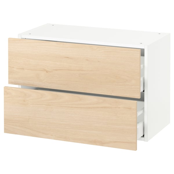 A white SEKTION kitchen cabinet with light ash wooden drawers. It has two drawers, a modern design, and a sturdy build.