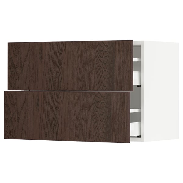 Dark brown wood kitchen cabinet with two open drawers.