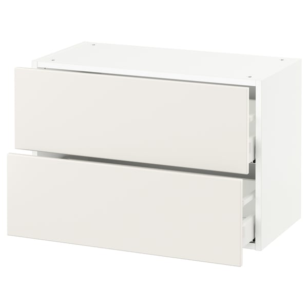 A white SEKTION kitchen cabinet with a sleek modern design, featuring two smooth-running drawers.