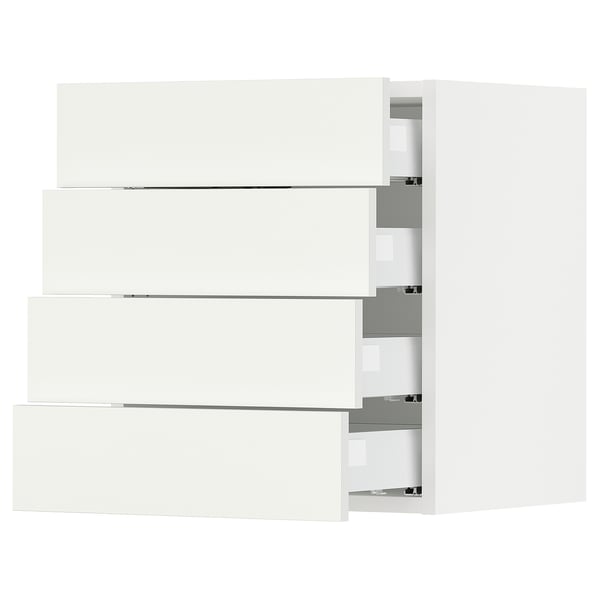 White SEKTION kitchen storage units with sleek, modern design and multiple drawers.