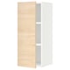 An open white cabinet with a light wooden door and a visible shelf inside.