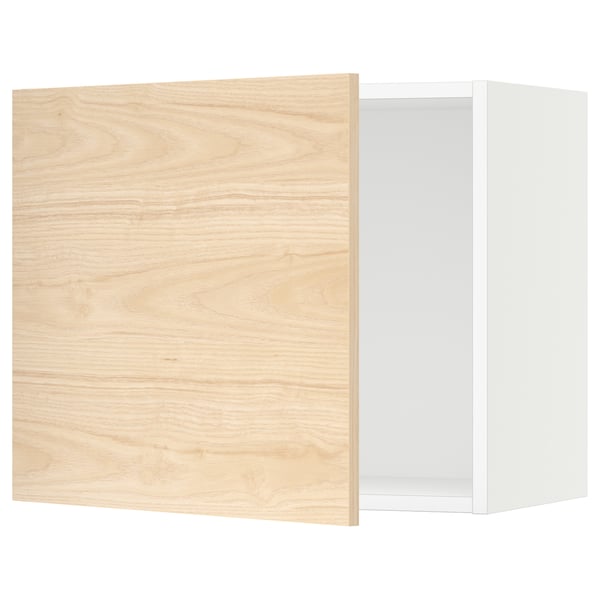 An open light oak-colored kitchen cabinet with a white interior. It a square shape and modern design.