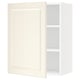 An off-white SEKTION kitchen cabinet with one door open, revealing adjustable shelves.
