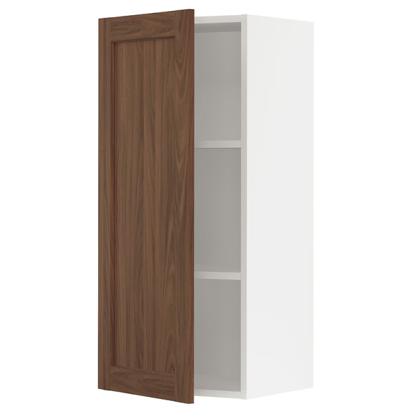 Ikea SEKTION walnut cabinet with open door, white frame, wood grain finish.