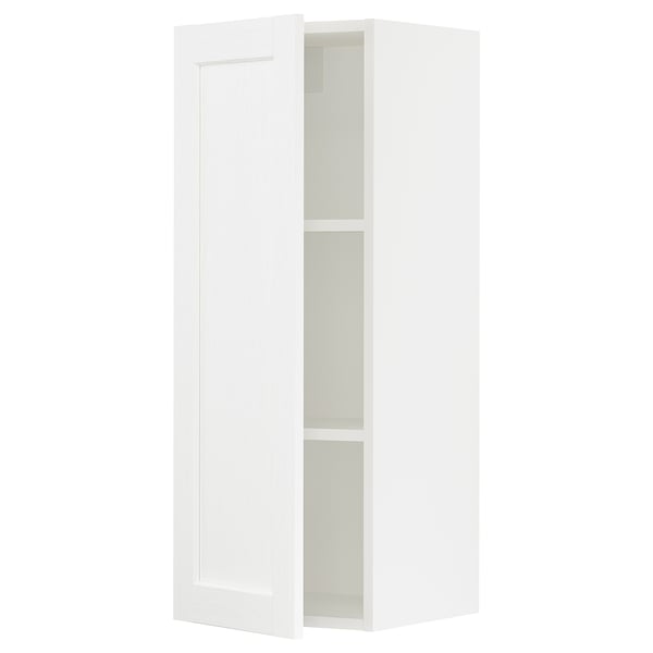 White SEKTION kitchen cabinet with adjustable shelves and dampened hinge.