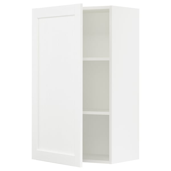 A white SEKTION kitchen cabinet with a door partially open, revealing two shelves inside.