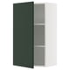 A SEKTION kitchen cabinet with a dark green havstorp door, white frame, two shelves, and a door damper.
