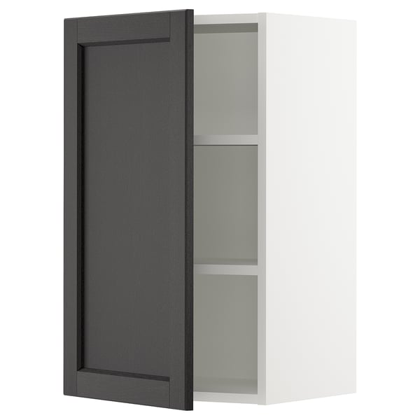 Displays a black stained wooden cabinet door with bevelled edges from IKEAs SEKTION kitchen system.