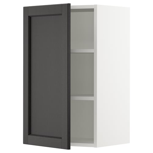 Displays a black stained wooden cabinet door with bevelled edges from IKEAs SEKTION kitchen system.