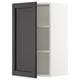 Displays a black stained wooden cabinet door with bevelled edges from IKEAs SEKTION kitchen system.