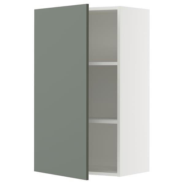 Modern kitchen cabinet with teal-green door, open right, adjustable shelves.