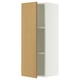 A white SEKTION wall cabinet with a light oak veneer door open, revealing an adjustable shelf inside.