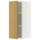 A white SEKTION wall cabinet with a light oak door, featuring an adjustable shelf inside.