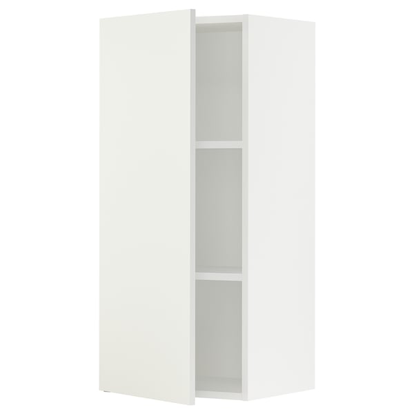 A white SEKTION kitchen corner cabinet with adjustable shelves.