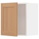 A light oak wooden cabinet door from the ikea SEKTION series. It a minimalist design with a natural, warm look.