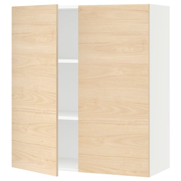An ikea SEKTION kitchen cabinet with light ash wood-patterned doors and white interior shelves.