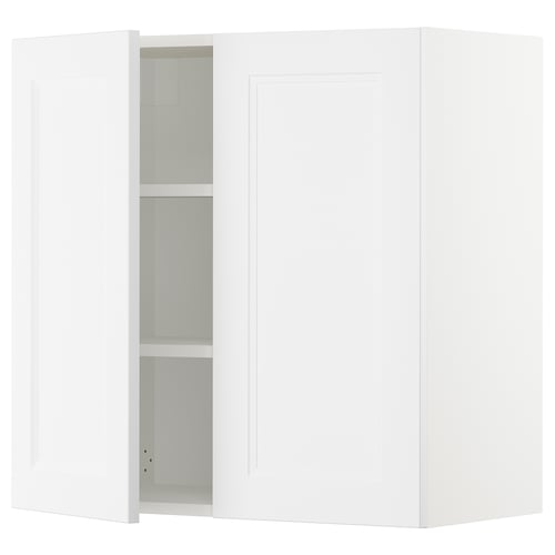 Depicts a white SEKTION kitchen cabinet with one open door revealing adjustable shelves.