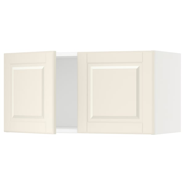 Displays white SEKTION kitchen wall cabinets with a classic design and bevelled edges.