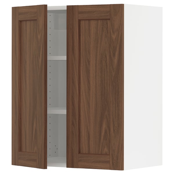 Image shows SEKTION kitchen cabinet with walnut-colored doors and white interior. Two doors are open, revealing an adjustable shelf.