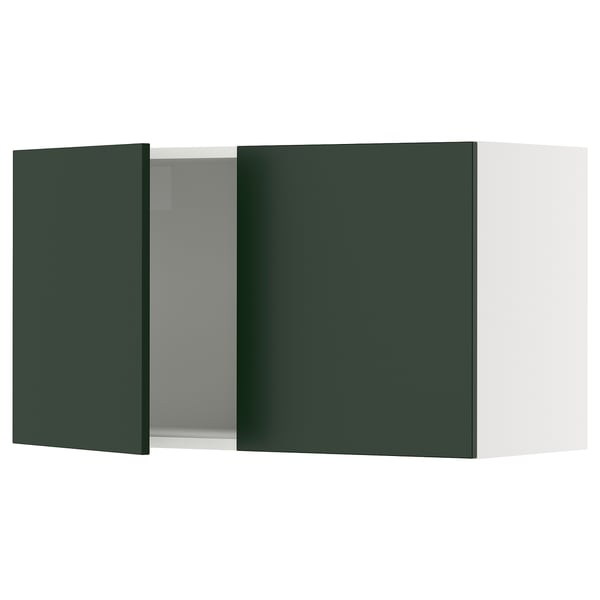 Green ikea SEKTION kitchen cabinet with one open door, white interior.