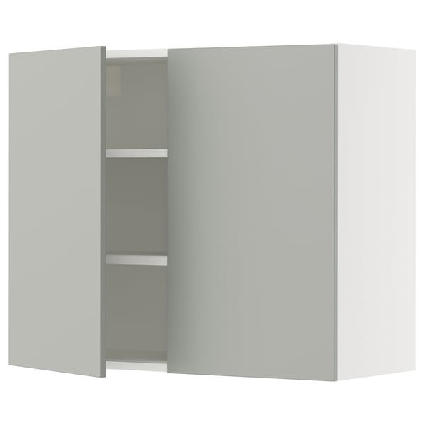 A modern light grey kitchen cabinet from the SEKTION system. It two doors and adjustable shelves.