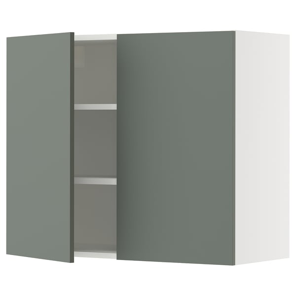 A modern grey-green cabinet with two doors from IKEAs SEKTION kitchen system. It has a sleek, square shape with adjustable shelves inside.