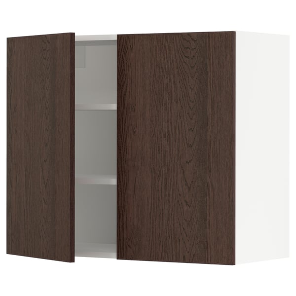 A dark brown oak SEKTION kitchen cabinet with one open door, revealing white adjustable shelves.
