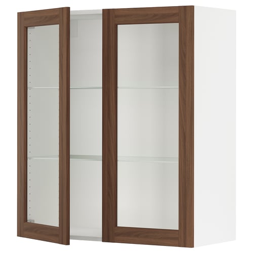An open white wall cabinet with wooden frames and glass shelves.