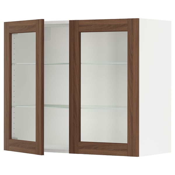 SEKTION kitchen cabinet with walnut glass doors, white frame, and three clear glass shelves.