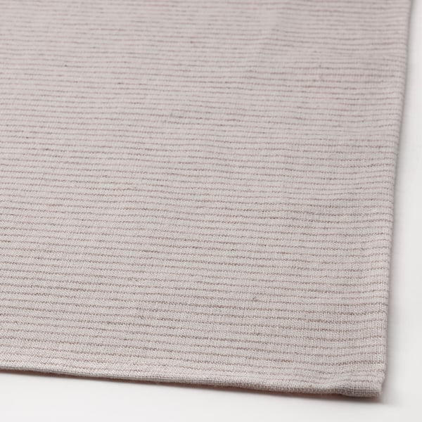 Soft, woven tablecloth in neutral tones, showcasing natural cotton and jute texture.