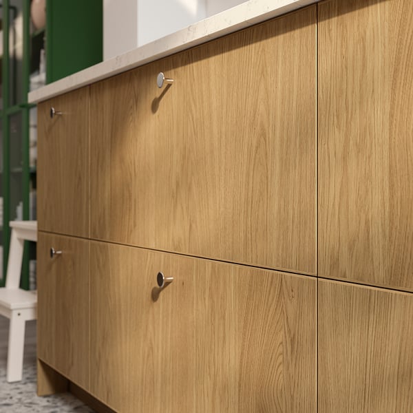 Natural wood cabinet with clean lines and metallic handles.