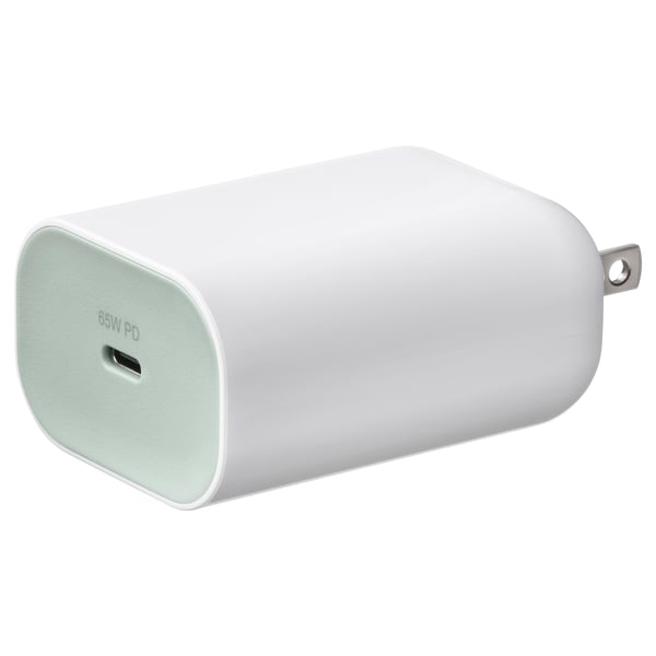 White, oval usb-c charger with green cap; lightweight, portable, fast-charging device.