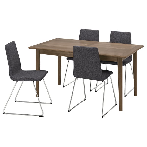 A SKANSNÄS dining set with a brown wooden table and four grey chairs with metal sled bases.