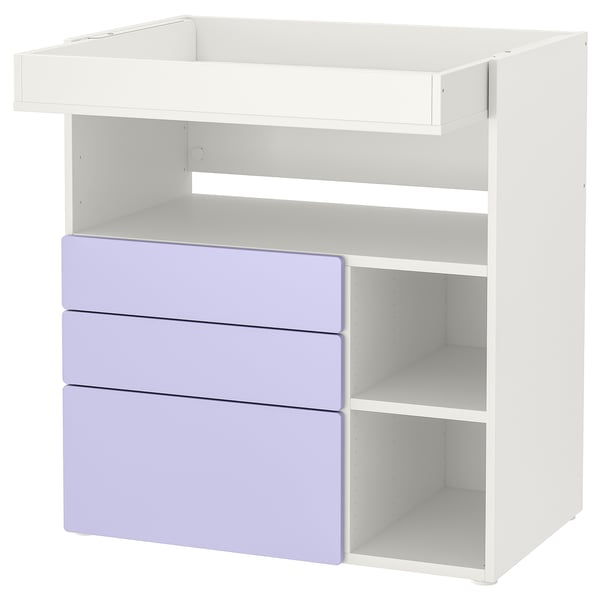 White changing table with 3 lavender drawers, open shelves.