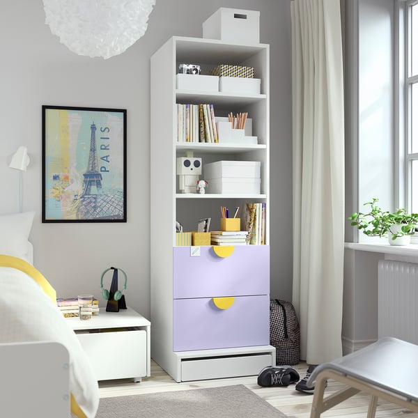 Kids bedroom with SMÅSTAD bookcase, colourful drawers, books, toys, paris map, and small bed.