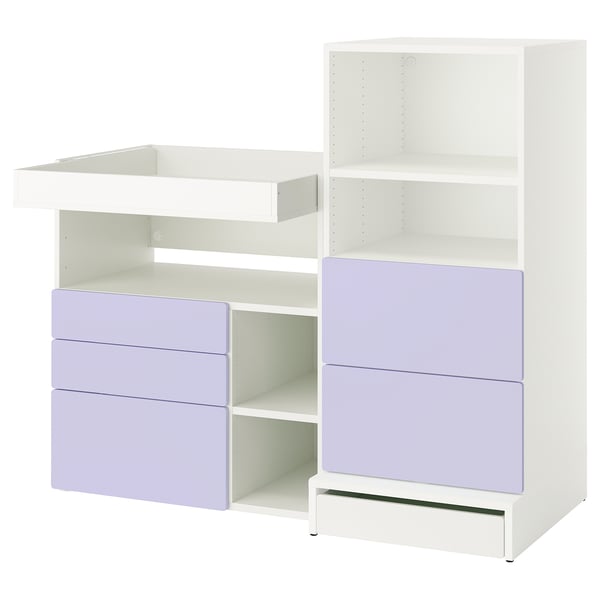 A white and lavender SMÅSTAD changing table and storage unit, featuring shelves and drawers, designed for a nursery.