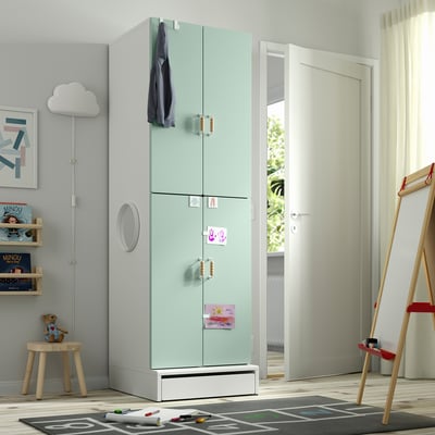 Kids room with SMÅSTAD light green wardrobe, toys, and play mat.