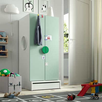 Childs room with SMÅSTAD wardrobe, toys, and decorations. Tall, fits well, multiple storage options.