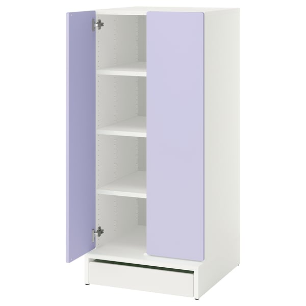 A white childrens cabinet with purple doors, open to reveal shelves and a drawer.