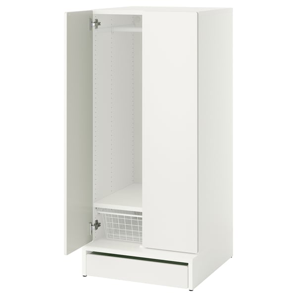 A white SMÅSTAD wardrobe for children, with one door open, revealing adjustable shelves and a soft-closing hinge.