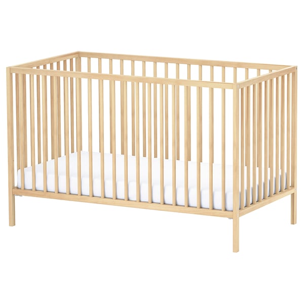 SNIGLAR beechwood crib, natural. Simple, rectangular design, ventilated base, white mattress inside.