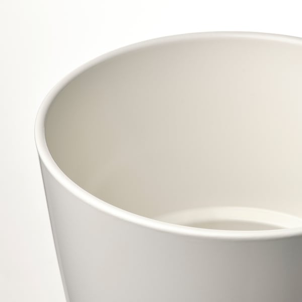 Closeup of a sleek, white matte plant pots rim and interior. Elegant, smooth finish.
