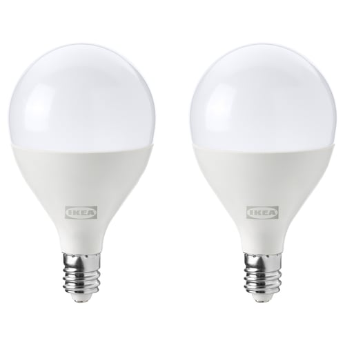 Two white, spherical ikea led light bulbs with e12 base, dimmable, energy-efficient.