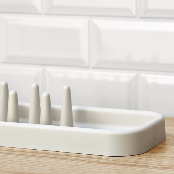 White dish drainer on counter.