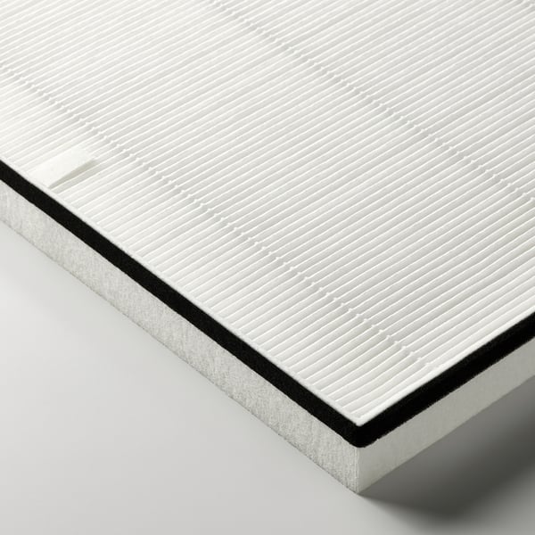 Close-up: premium air philtre, clean, white with black edge. High-density design for effective particle removal.