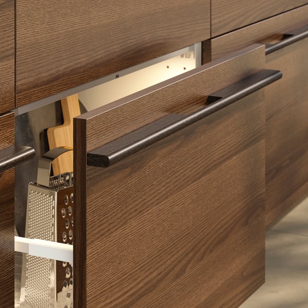 Dark brown wooden kitchen cabinets with sleek handles, showcasing visible wood grain and a modern design.