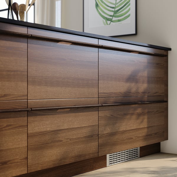 Modern kitchen with dark brown wood cabinets, sleek handles, and clean lines.