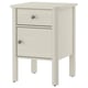 White STOREMOLLA bedside table with drawer and cabinet. Made of solid wood with metal knobs, rectangular shape.