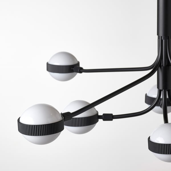 Modern chandelier with 8 spherical led lights on black arms, well-crafted and sleek design.